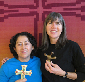 Paz and Denise holding gift crosses Paz and Denise holding gift crosses